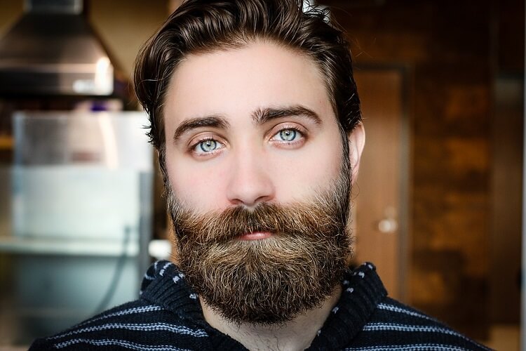 a young man with a bushy beard