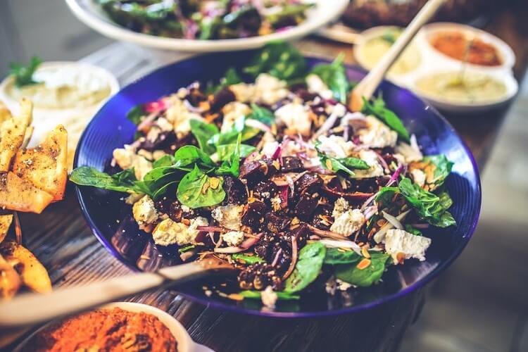 a bowl of spinach salad