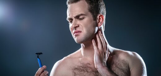 a young man with a shaving razor