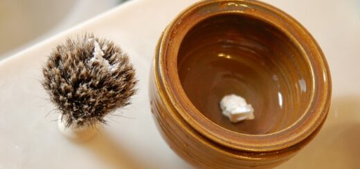 a shaving scuttle bowl and a brush