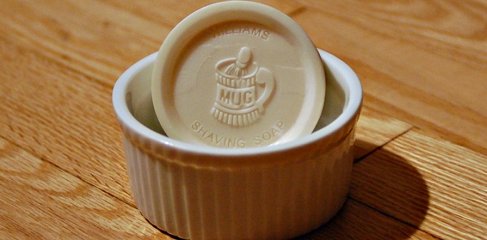 a round unscented shaving soap in a small bowl