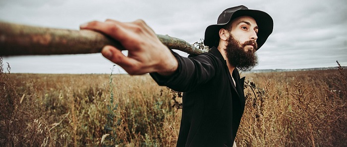 a young man with a long beard