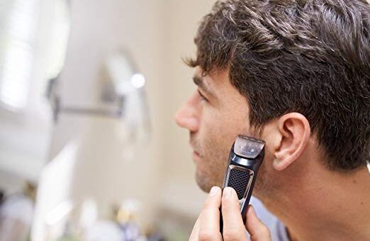 man using philips norelco shaver